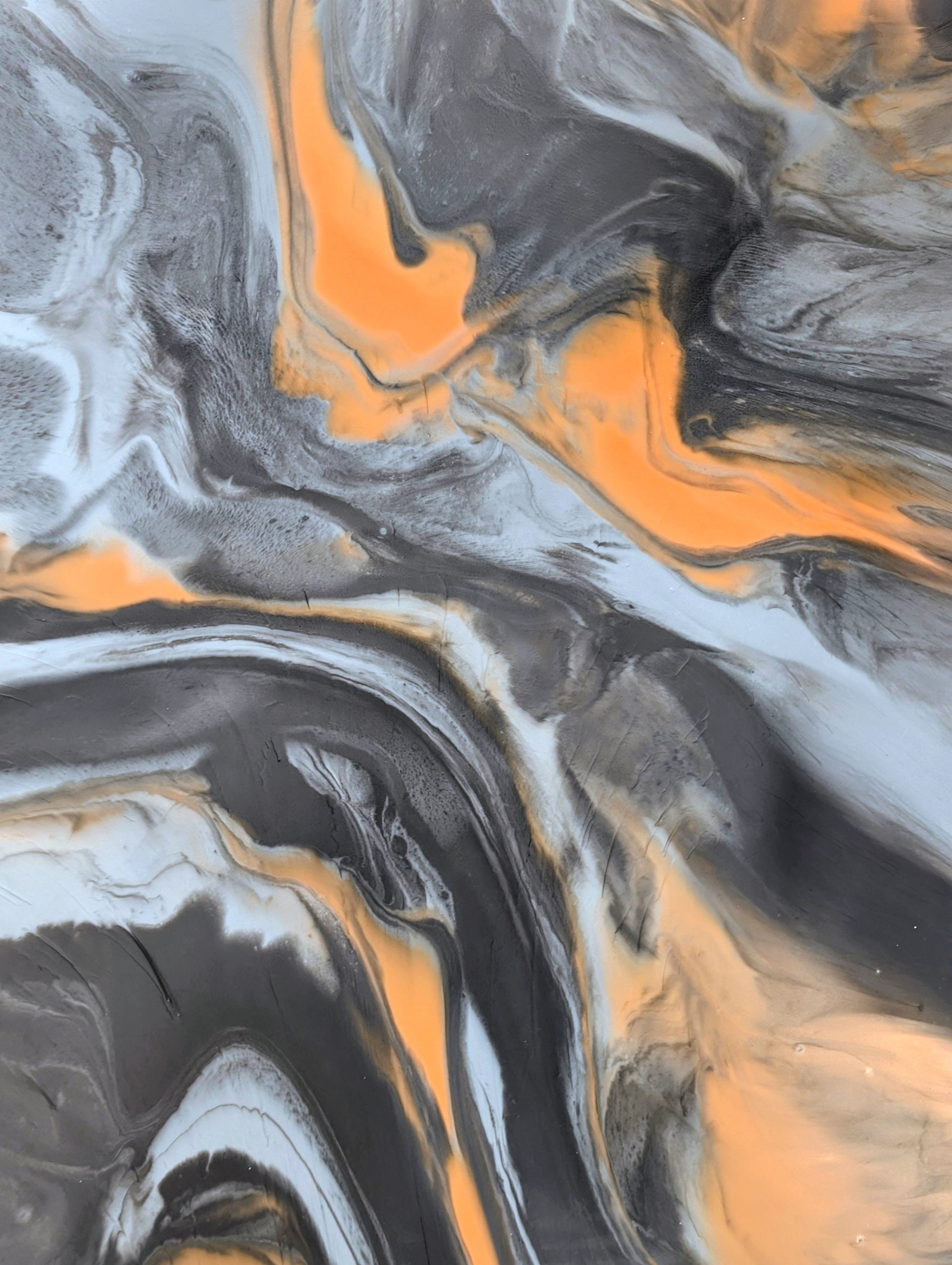 Metallic epoxy black orange silver swirl