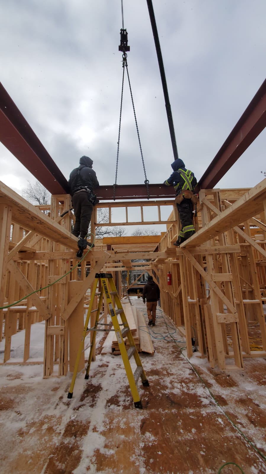 Team installing beams